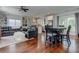 Open-concept living room with hardwood floors, built-in shelving, and a ceiling fan at 2972 Lookout Ne Pl, Atlanta, GA 30305