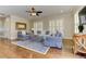 Inviting living room with hardwood floors, comfortable seating, and a modern ceiling fan at 2972 Lookout Ne Pl, Atlanta, GA 30305
