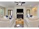 Living room with a fireplace, hardwood floors and large comfortable couches at 2972 Lookout Ne Pl, Atlanta, GA 30305