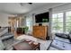 Bright living room with a large TV, classic furniture, and ample natural light at 2972 Lookout Ne Pl, Atlanta, GA 30305