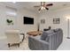 A cozy living room features a large screen TV, neutral paint, and carpet at 2972 Lookout Ne Pl, Atlanta, GA 30305