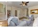 Spacious living room with hardwood floors, plush seating, and convenient access to the stairs at 2972 Lookout Ne Pl, Atlanta, GA 30305