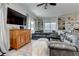 Cozy living room with plush seating, built-in shelving, and a vintage wooden cabinet at 2972 Lookout Ne Pl, Atlanta, GA 30305