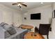 Living room features neutral paint, a large screen TV, recessed lighting, and carpet at 2972 Lookout Ne Pl, Atlanta, GA 30305
