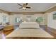Spacious main bedroom with hardwood floors, a king bed, and large windows at 2972 Lookout Ne Pl, Atlanta, GA 30305