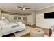 Main bedroom with a king bed, a TV, and access to the luxurious main bathroom at 2972 Lookout Ne Pl, Atlanta, GA 30305