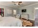 The main bedroom features hardwood floors, a walk-in closet, and a tv at 2972 Lookout Ne Pl, Atlanta, GA 30305