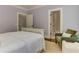 Comfortable main bedroom featuring an accent chair, with convenient access to the en-suite bathroom at 2972 Lookout Ne Pl, Atlanta, GA 30305