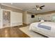 Large main bedroom with hardwood floors, a sitting area, and an en-suite bath at 2972 Lookout Ne Pl, Atlanta, GA 30305