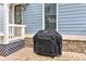 Outdoor patio featuring a Weber grill, stonework, and access to the house at 2972 Lookout Ne Pl, Atlanta, GA 30305