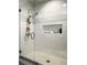 New bathroom featuring a glass shower with a subway tile and mosaic backsplash at 2972 Lookout Ne Pl, Atlanta, GA 30305