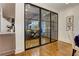 View from dining room of glass enclosed wine cellar with floor to ceiling shelving at 2972 Lookout Ne Pl, Atlanta, GA 30305