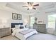 Bedroom with neutral gray decor, luxury vinyl plank flooring, and large windows at 541 Fundao Ln, Lawrenceville, GA 30046