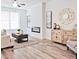 Inviting living room showcasing an electric fireplace, stylish furnishings, neutral colors, and lots of natural light at 541 Fundao Ln, Lawrenceville, GA 30046