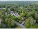 Aerial view of a neighborhood with mature trees and several homes with swimming pools at 6203 Crestview Drive Southeast Se Dr, Covington, GA 30014
