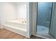 Bathroom featuring a tiled tub with steps and glass enclosed shower at 6203 Crestview Drive Southeast Se Dr, Covington, GA 30014