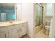 Bathroom featuring a vanity with a sink, a toilet, and a shower with sliding glass doors at 6203 Crestview Drive Southeast Se Dr, Covington, GA 30014