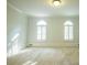 Bright bedroom with neutral carpet and two windows with white shutters at 6203 Crestview Drive Southeast Se Dr, Covington, GA 30014
