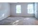 Bedroom featuring two windows that provide natural light and a door on the side at 6203 Crestview Drive Southeast Se Dr, Covington, GA 30014