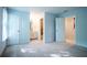 Bright bedroom with neutral carpet, white walls, bathroom and closet doors at 6203 Crestview Drive Southeast Se Dr, Covington, GA 30014