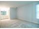 Spacious bedroom with neutral carpet and a bathroom to the side at 6203 Crestview Drive Southeast Se Dr, Covington, GA 30014