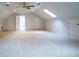 Bonus room featuring vaulted ceilings, skylights, a ceiling fan, and multiple doors at 6203 Crestview Drive Southeast Se Dr, Covington, GA 30014