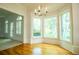 Bright breakfast nook with hardwood floors and large windows offering picturesque outdoor views at 6203 Crestview Drive Southeast Se Dr, Covington, GA 30014
