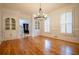 Dining room with hardwood floors, white walls, plantation shutters and built-in cabinets at 6203 Crestview Drive Southeast Se Dr, Covington, GA 30014