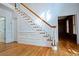 Inviting foyer with hardwood floors, elegant staircase, and traditional detailing at 6203 Crestview Drive Southeast Se Dr, Covington, GA 30014