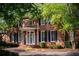 Close-up of a brick home with a covered entryway with white columns and dark shutters at 6203 Crestview Drive Southeast Se Dr, Covington, GA 30014