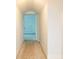 Hallway with neutral carpet and white walls that leads to another room at 6203 Crestview Drive Southeast Se Dr, Covington, GA 30014