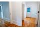 Hallway boasts parquet flooring and features access to various rooms, including one to the outside at 6203 Crestview Drive Southeast Se Dr, Covington, GA 30014