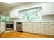 Modern kitchen with stainless steel appliances and white cabinets at 6203 Crestview Drive Southeast Se Dr, Covington, GA 30014