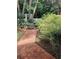 Beautiful landscaping featuring a brick path and white picket fence create a serene outdoor space at 6203 Crestview Drive Southeast Se Dr, Covington, GA 30014