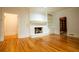 Living room featuring fireplace, hardwood floors, and built-in shelving at 6203 Crestview Drive Southeast Se Dr, Covington, GA 30014