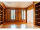 Office featuring hardwood floors, wood paneled walls, built-in bookcases and great natural light at 6203 Crestview Drive Southeast Se Dr, Covington, GA 30014