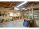 Bright basement workshop with workbenches and pegboards for tools, perfect for hobbies and home projects at 6878 Vic Ar Rd, Atlanta, GA 30360