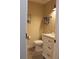 Cozy powder room featuring wood tile flooring and updated vanity with black hardware at 6878 Vic Ar Rd, Atlanta, GA 30360
