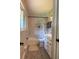 Clean bathroom with window, shower, and vanity with plenty of storage space at 6878 Vic Ar Rd, Atlanta, GA 30360