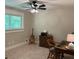 Home office/bedroom filled with natural light and featuring a classic wood desk at 6878 Vic Ar Rd, Atlanta, GA 30360