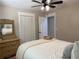 Comfortable bedroom featuring fan, dresser, closet and relaxing atmosphere for a good night's sleep at 6878 Vic Ar Rd, Atlanta, GA 30360