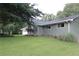 Scenic view of the home featuring a lush lawn and manicured landscaping surrounding the charming exterior at 6878 Vic Ar Rd, Atlanta, GA 30360