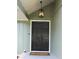 A close-up view of the front door and lantern-style light, highlighting the entryway's architectural details at 6878 Vic Ar Rd, Atlanta, GA 30360