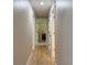 Inviting hallway with hardwood floors and white trim, leading to other rooms at 6878 Vic Ar Rd, Atlanta, GA 30360