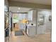 Bright kitchen featuring white cabinets, stainless steel appliances, and a view to dining area at 6878 Vic Ar Rd, Atlanta, GA 30360