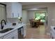 Open-concept kitchen featuring stainless steel appliances and a view of the dining area at 6878 Vic Ar Rd, Atlanta, GA 30360