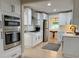 Modern kitchen with stainless steel appliances and white cabinets at 6878 Vic Ar Rd, Atlanta, GA 30360