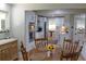 Lovely kitchen with stainless appliances, white cabinets, and open dining area at 6878 Vic Ar Rd, Atlanta, GA 30360