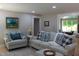 Inviting living room with plush seating, stylish decor, and abundant natural light at 6878 Vic Ar Rd, Atlanta, GA 30360