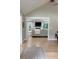 Open-concept living area boasting hardwood floors, a fireplace, and a view to an adjacent room at 6878 Vic Ar Rd, Atlanta, GA 30360